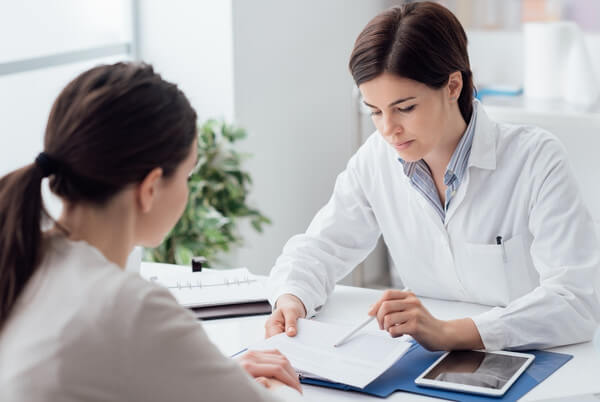 Doctor discussing a treatment plan with a patient during a consultation