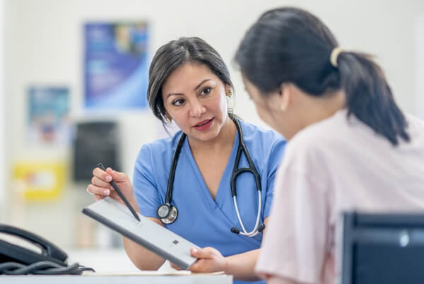 Doctor discussing medical information with a patient during an appointment