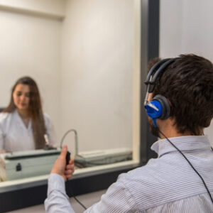 Person wearing headphones during an audiometry hearing test
