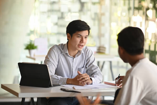 Business professional discussing workplace health services during a consultation