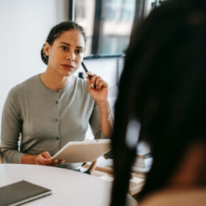 Health professional speaking with a patient during a functional capacity assessment