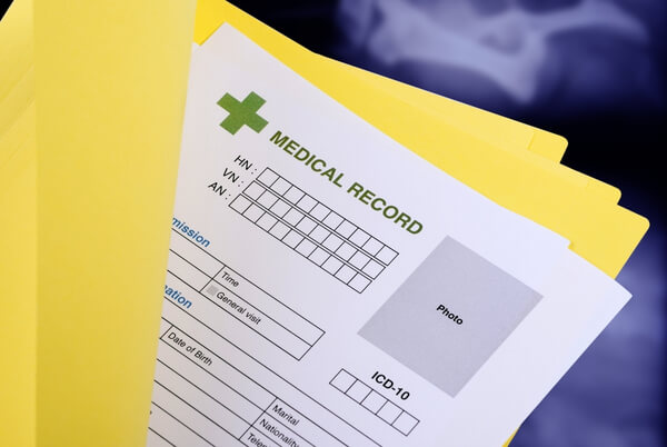 Medical record form inside a yellow patient file